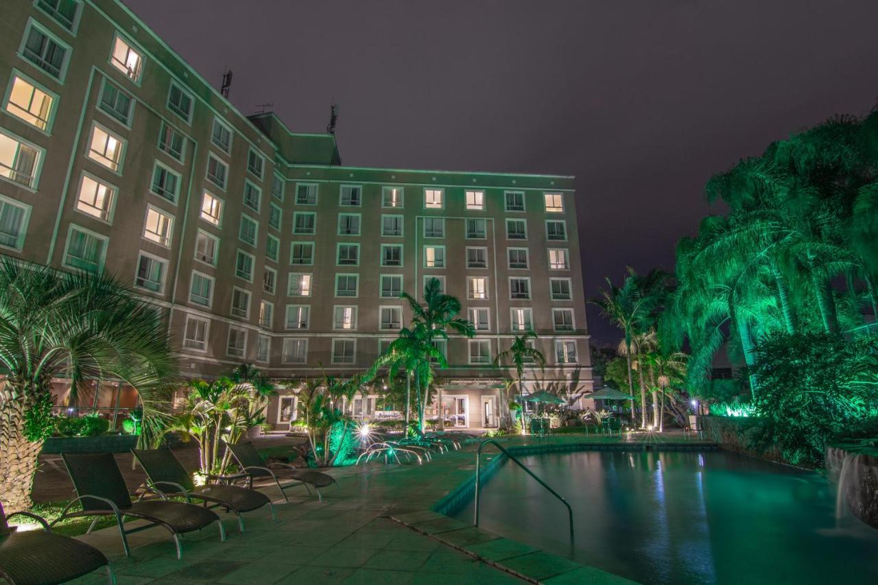 Hotel Deville Prime Porto Alegre Exterior photo The hotel's pool at night